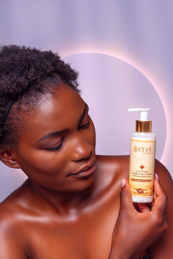 Model holding Jipende Gentle Face Wash